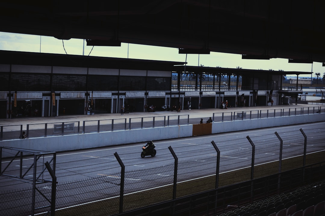 motogp 2026 calendar schedule - Motorcyclist on a race track with grandstands.