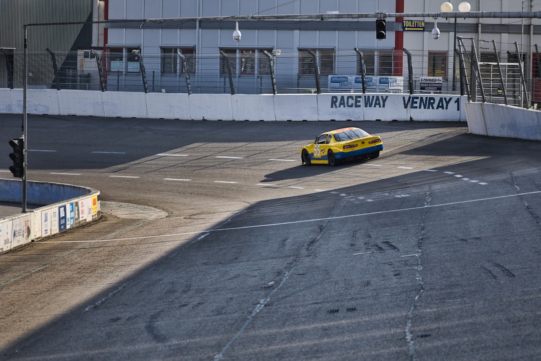indycar schedule 2025 - Yellow race car on a track at daytime.