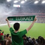 Norwich City vs Ipswich - Fan holds up euskadi scarf in stadium crowd