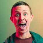 viral WTF moments - man in green crew neck shirt smiling