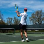 gabriel diallo vs zverev prediction - a man standing on a tennis court holding a racquet