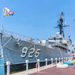 uss cleveland lcs 31 commissioning 2026 - a large ship is docked at a pier